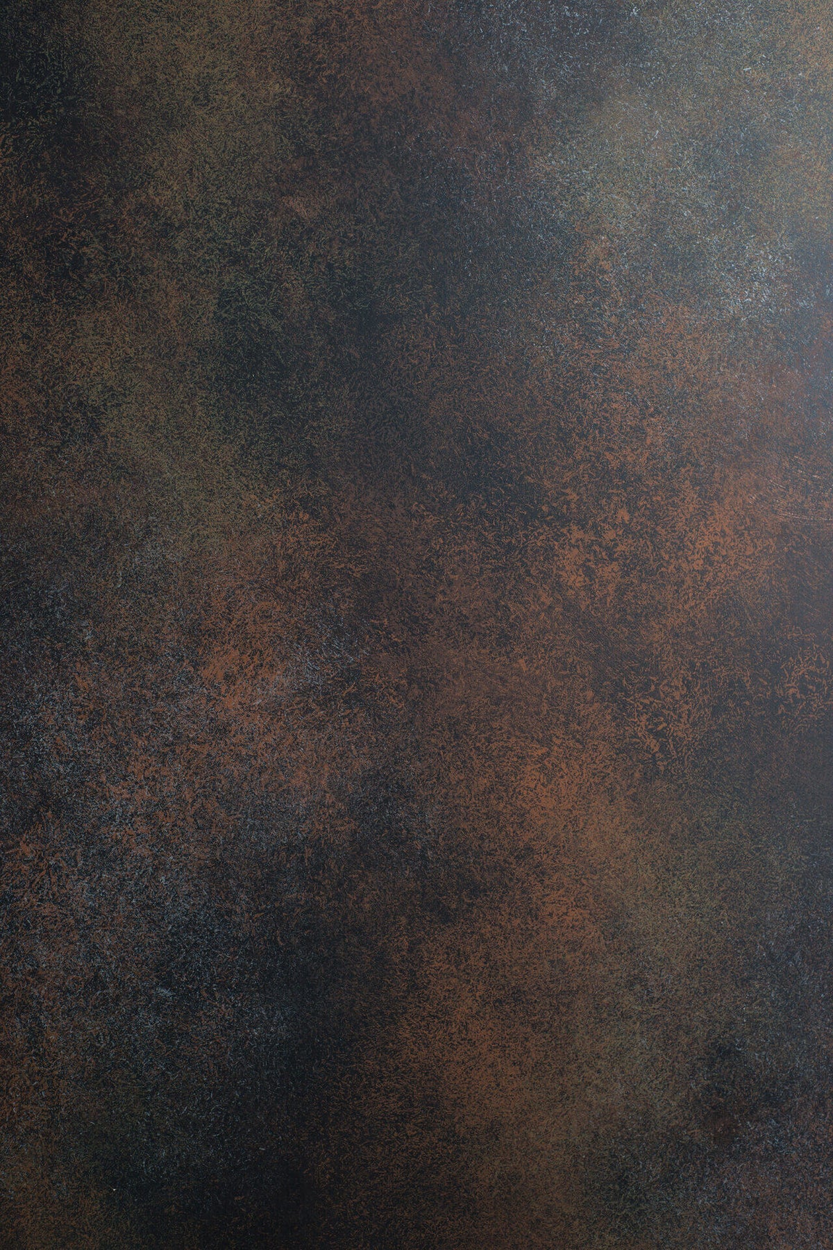A dark brown product backdrop with small specks